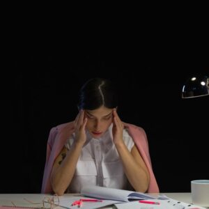 mental health workers compensation stressed worker at desk